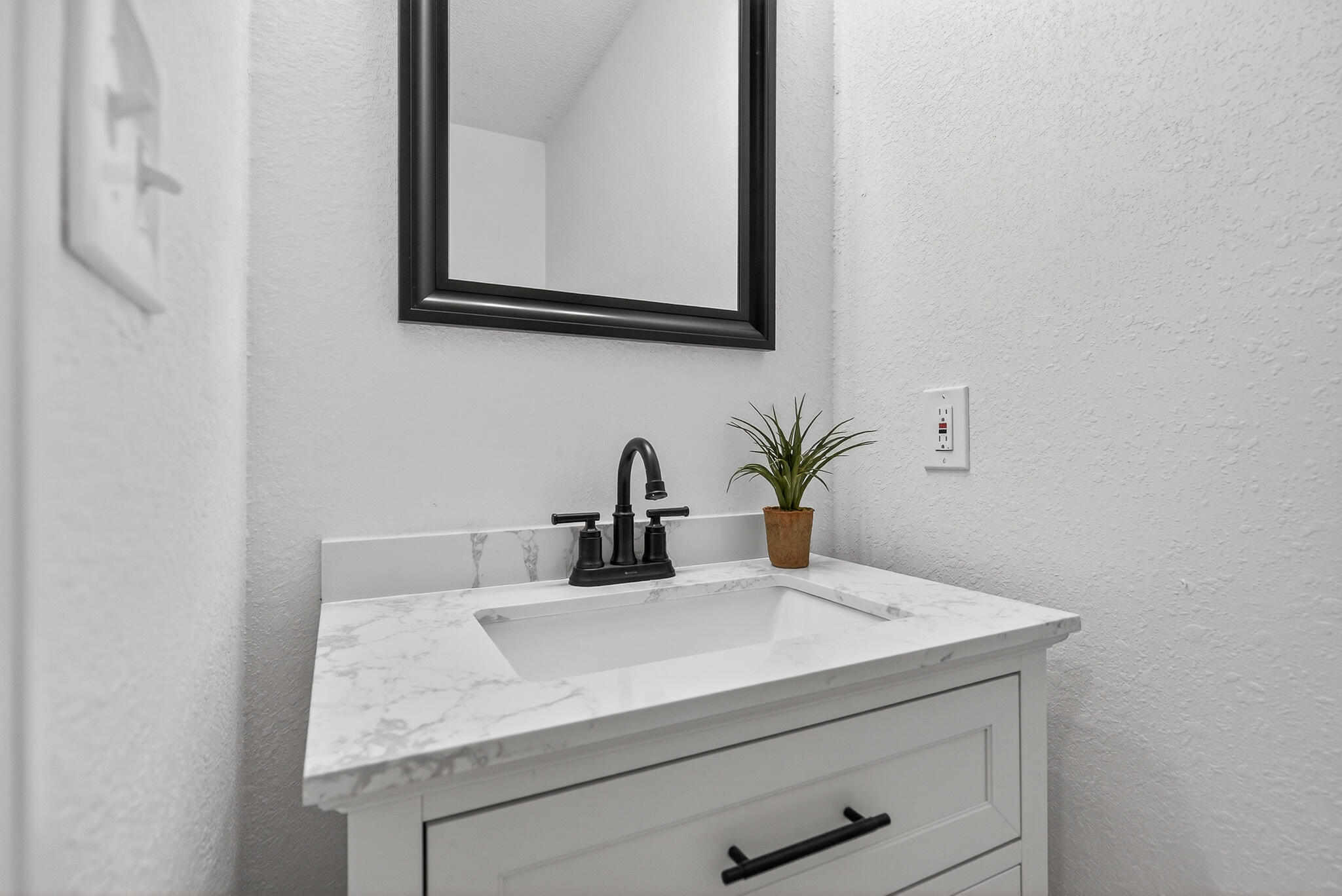 4297 Edge Perry Road Crestview, FL 32539 - Photo 50 of 70 a bathroom with a sink and a mirror