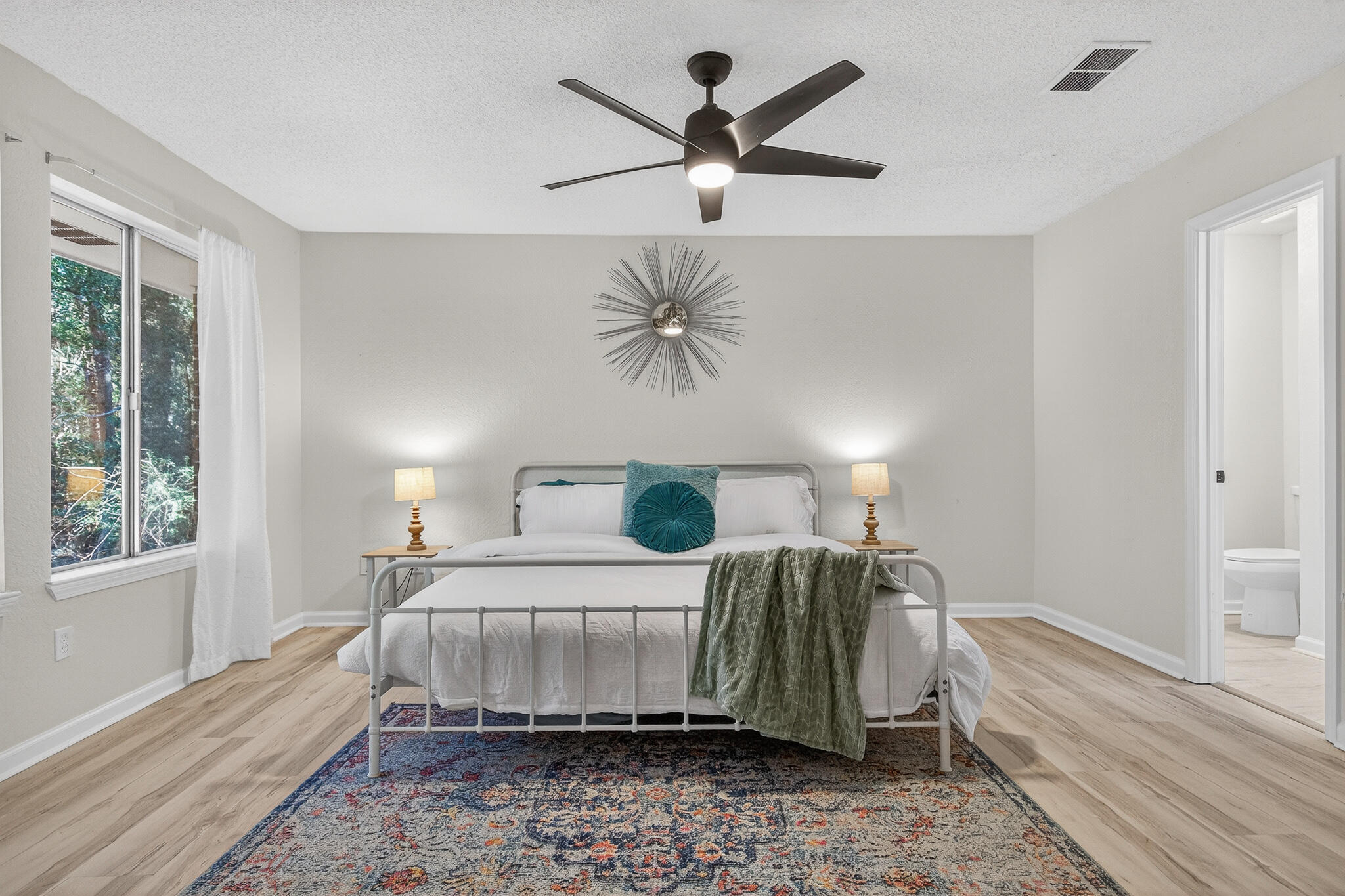 4297 Edge Perry Road Crestview, FL 32539 - Photo 52 of 70 a bedroom with a bed and a chandelier