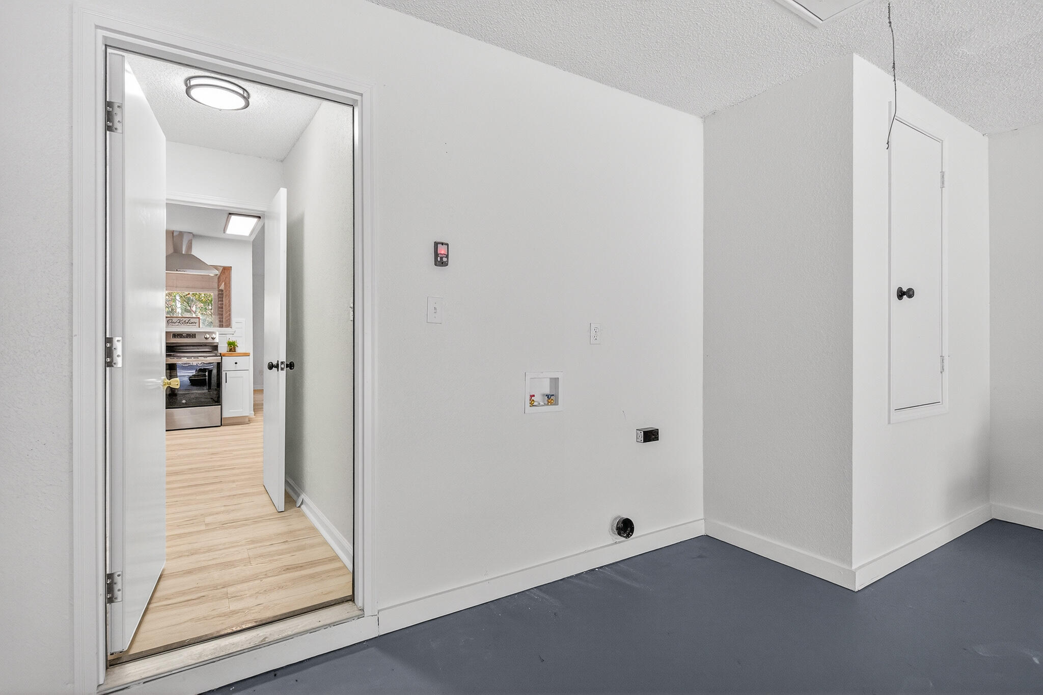 4297 Edge Perry Road Crestview, FL 32539 - Photo 60 of 70 a view of a hallway with wooden floor and closet