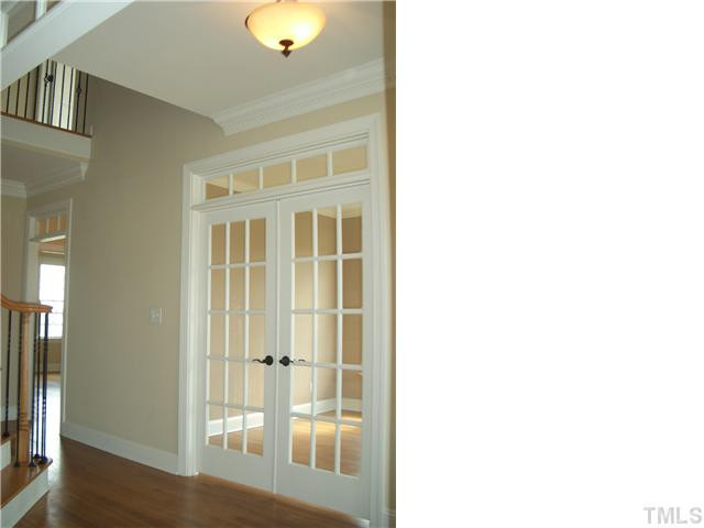 Center Hall Foyer with French Doors leading into the Formal Study. Foyer