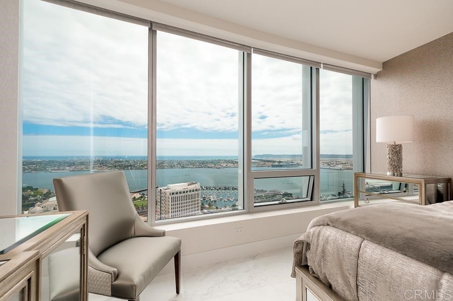 888 West E Street San Diego, CA 92101 - Photo 11 of 30 a bedroom with a large window and a bed