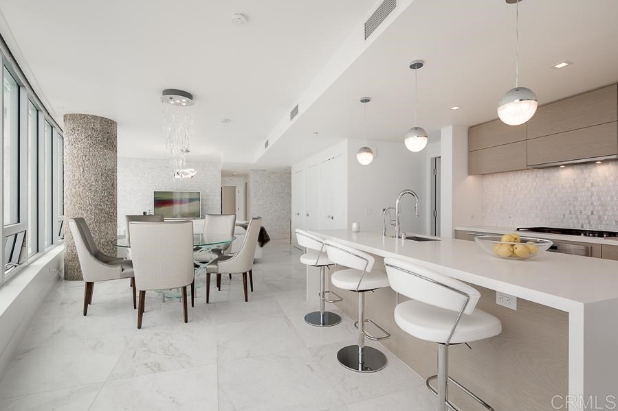 888 West E Street San Diego, CA 92101 - Photo 7 of 30 a large kitchen with a table and chairs