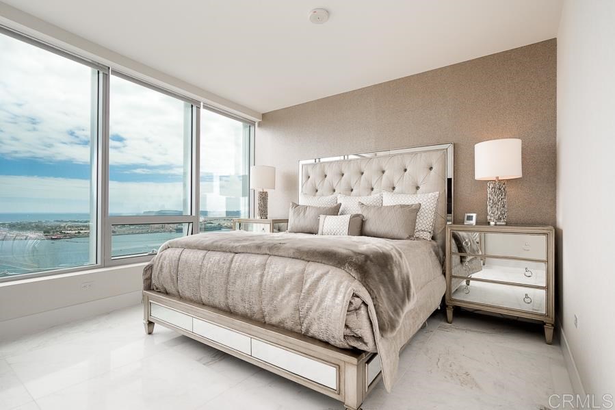 888 West E Street San Diego, CA 92101 - Photo 10 of 30 a bed sitting in a bedroom next to a window