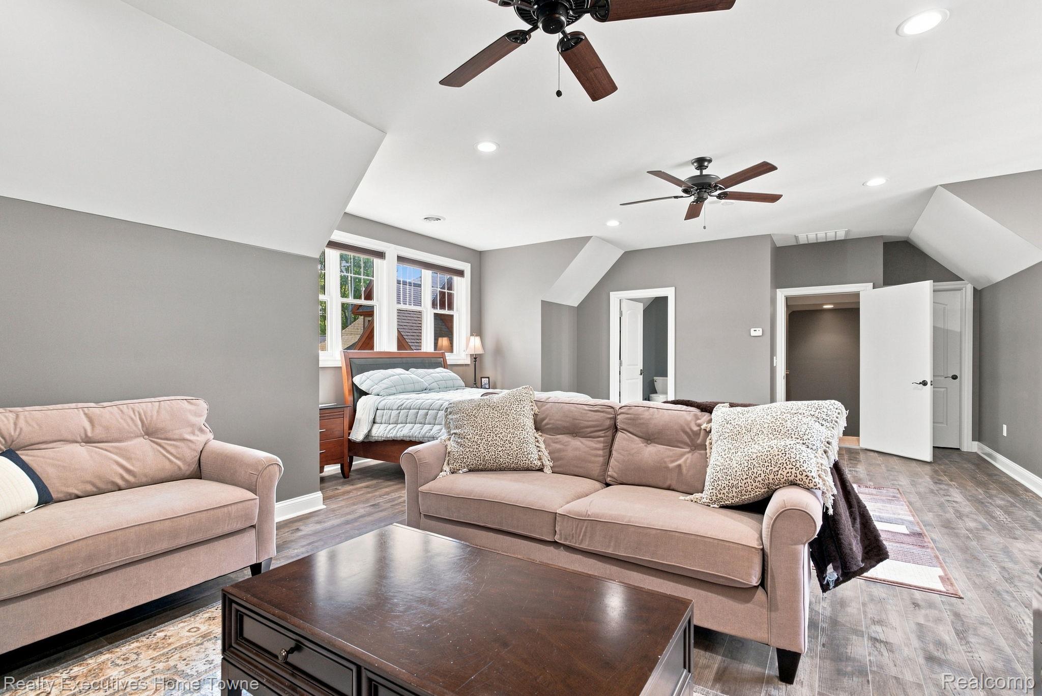 2829 Riverside Drive Port Huron, MI 48060 - Photo 33 of 99 Sloped ceilings, wood-finish flooring, recessed lighting, and multiple ceiling fans