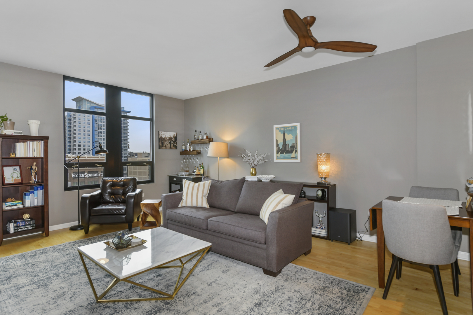 1255 South State Street, Unit 807 Chicago, IL 60605 - Photo 3 of 13 a living room with furniture a rug and a window