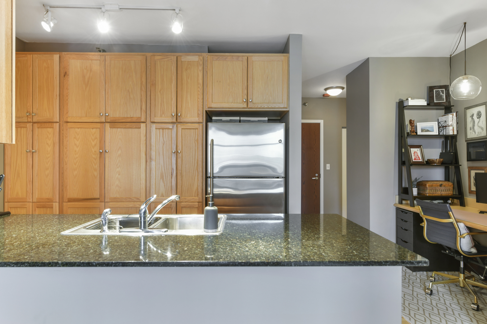 1255 South State Street, Unit 807 Chicago, IL 60605 - Photo 7 of 13 a bathroom with a granite countertop sink and a mirror