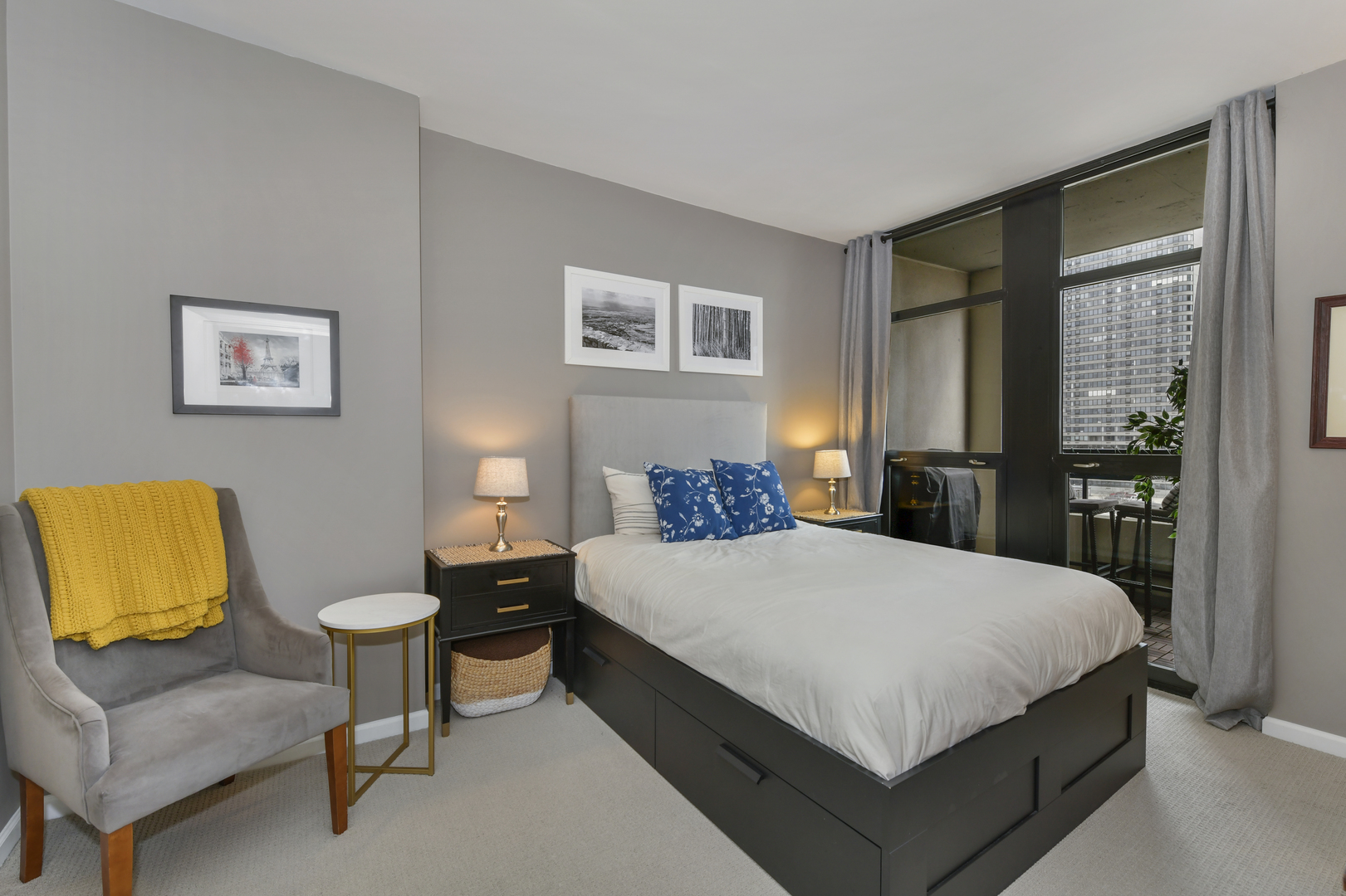 1255 South State Street, Unit 807 Chicago, IL 60605 - Photo 9 of 13 a bedroom with a bed and a couch