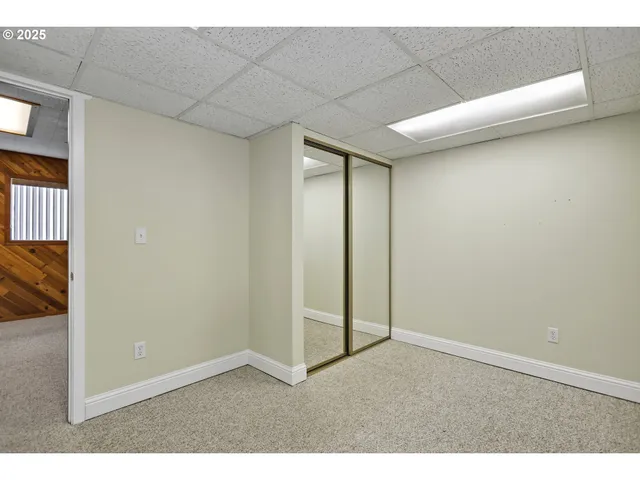 a living room with a couch and chairs