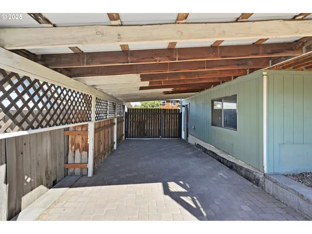 a view of a wooden deck with a yard