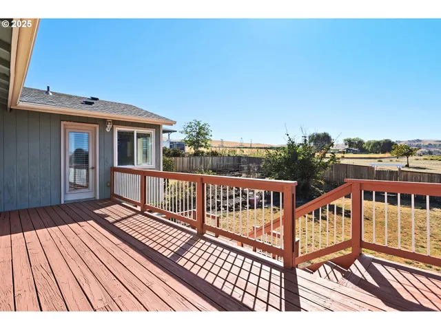 a view of a backyard and a patio