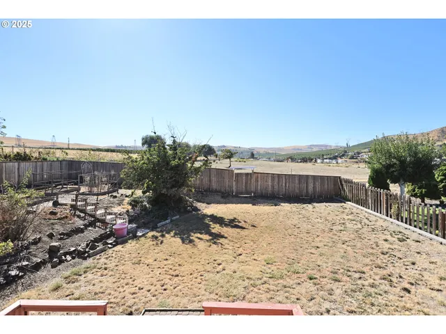 a view of swimming pool with a yard