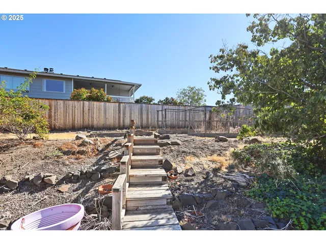 a view of a wooden fence