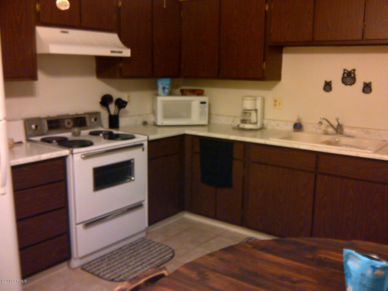 830 South Dobson Road, Unit 63 Mesa, AZ 85202 - Photo 1 of 9 a kitchen with a sink cabinets and stainless steel appliances