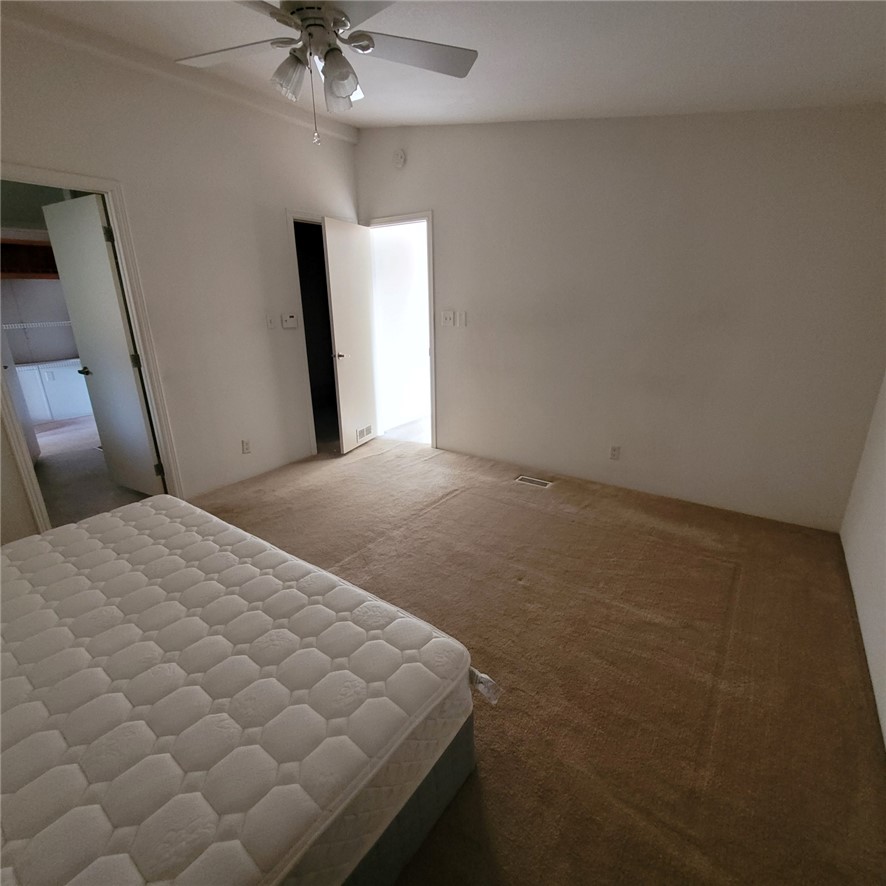 9732 2nd Street Chloride, AZ 86431 - Photo 21 of 28 This room features neutral-toned carpet, a ceiling fan, and white walls