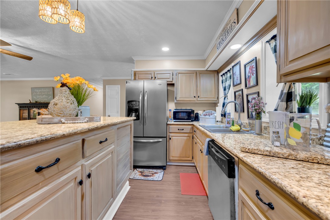 3030 Smith McGee Road Iva, SC 29655 - Photo 20 of 46 A well-lit kitchen with granite counters and stainless steel appliances awaits culinary adventures.