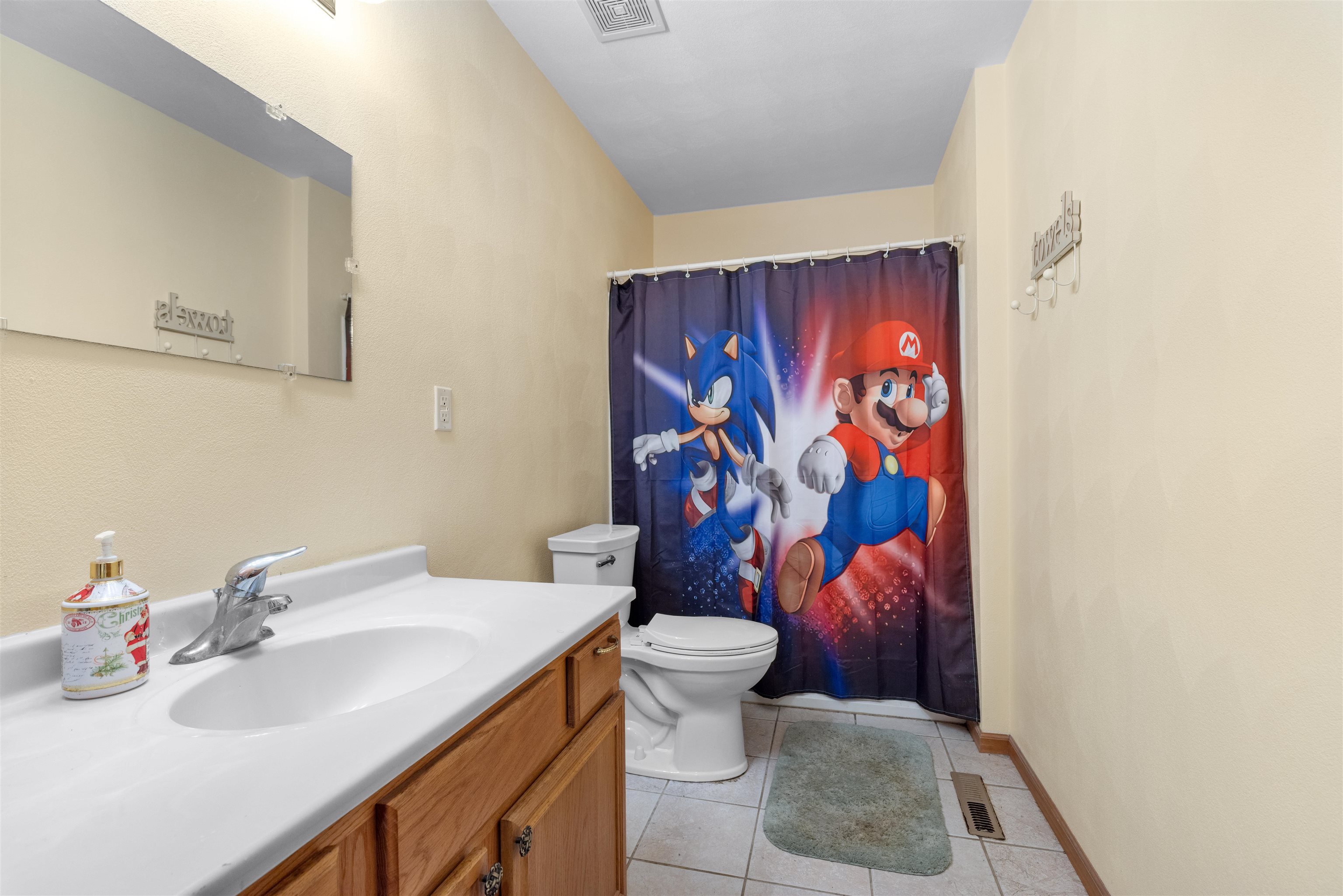 1405 Sentry Drive Durand, IL 61024 - Photo 15 of 25 a bathroom with a sink toilet and shower