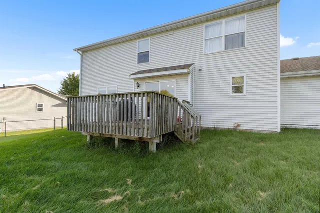 a view of a big house with a big yard