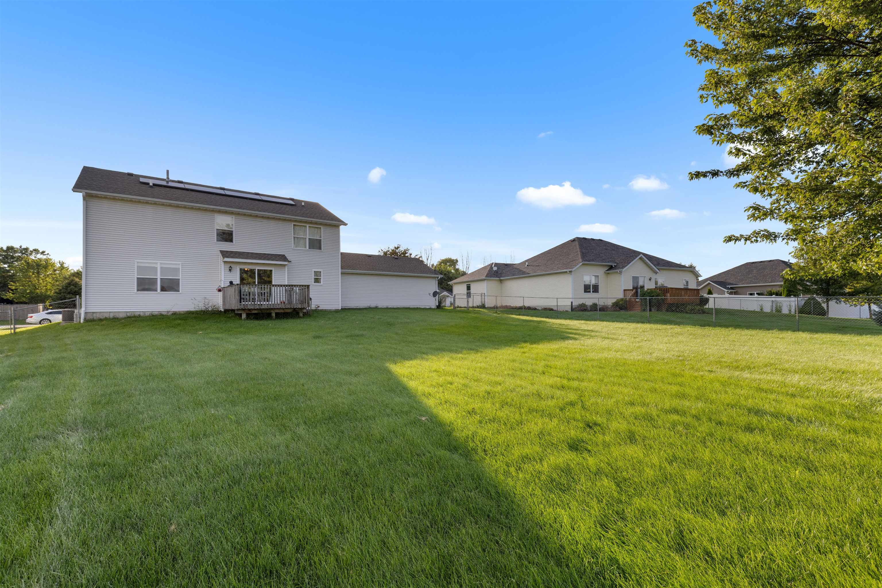 1405 Sentry Drive Durand, IL 61024 - Photo 20 of 25 a view of a big house with a big yard