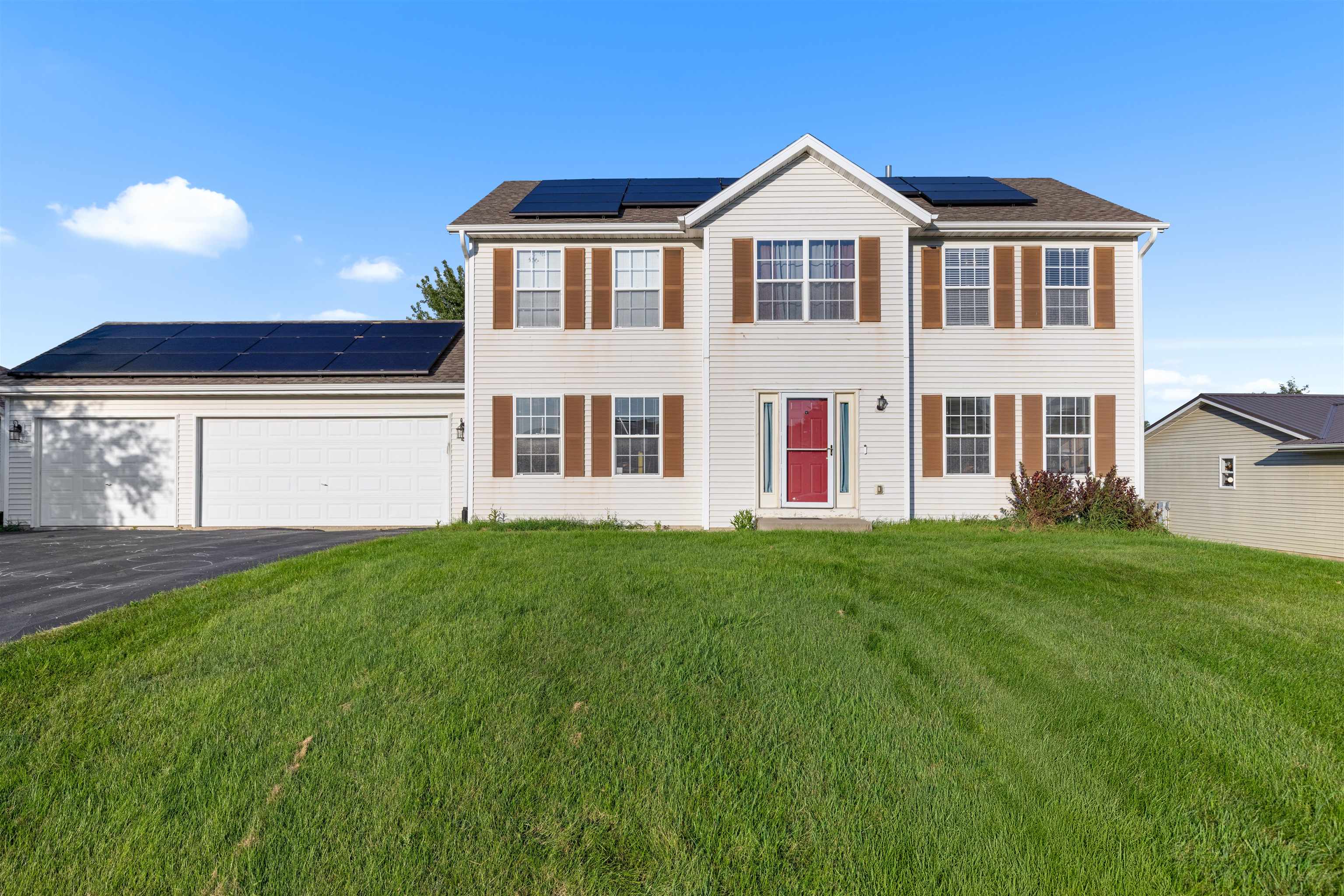 1405 Sentry Drive Durand, IL 61024 - Photo 2 of 25 a front view of a house with a yard