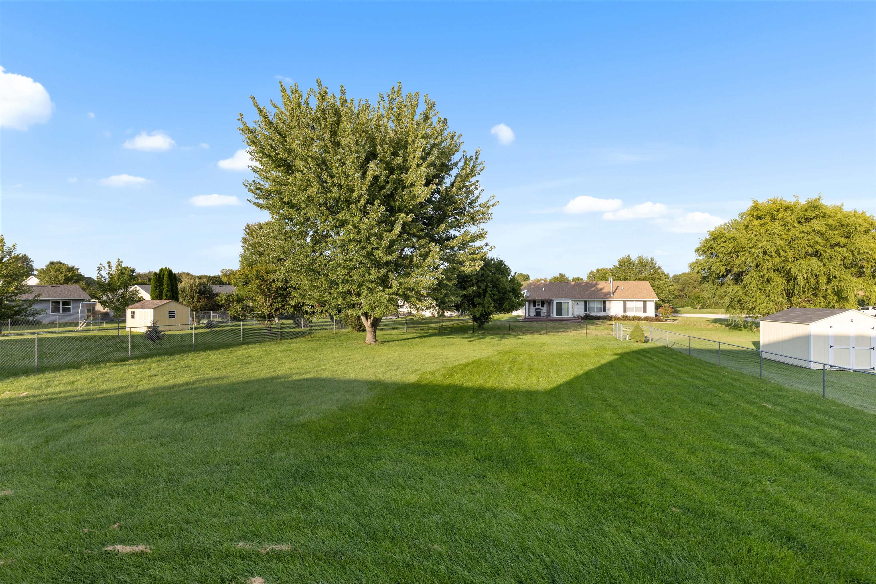 1405 Sentry Drive Durand, IL 61024 - Photo 21 of 25 a view of a golf course with a lake