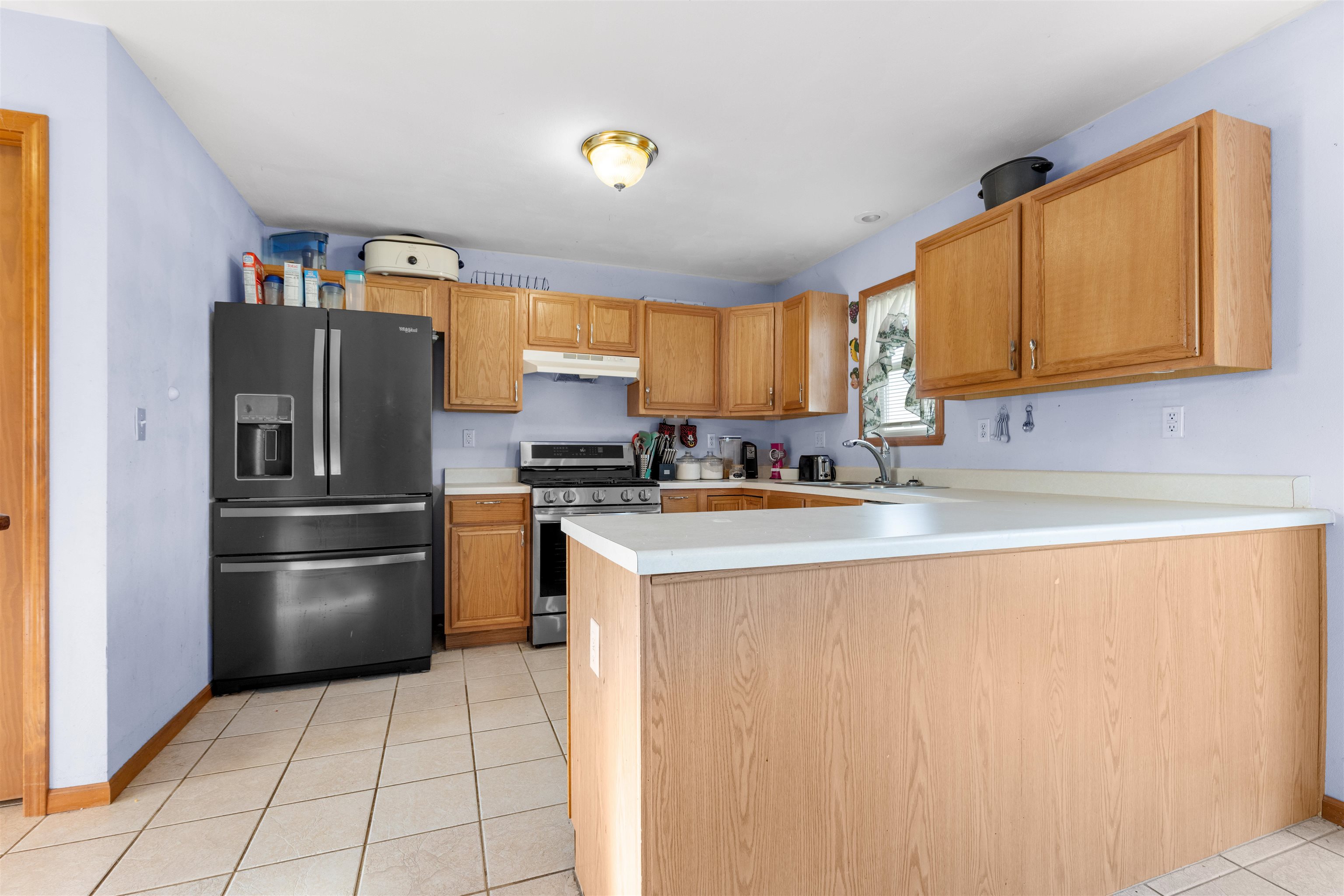 1405 Sentry Drive Durand, IL 61024 - Photo 5 of 25 a kitchen with a refrigerator sink and microwave