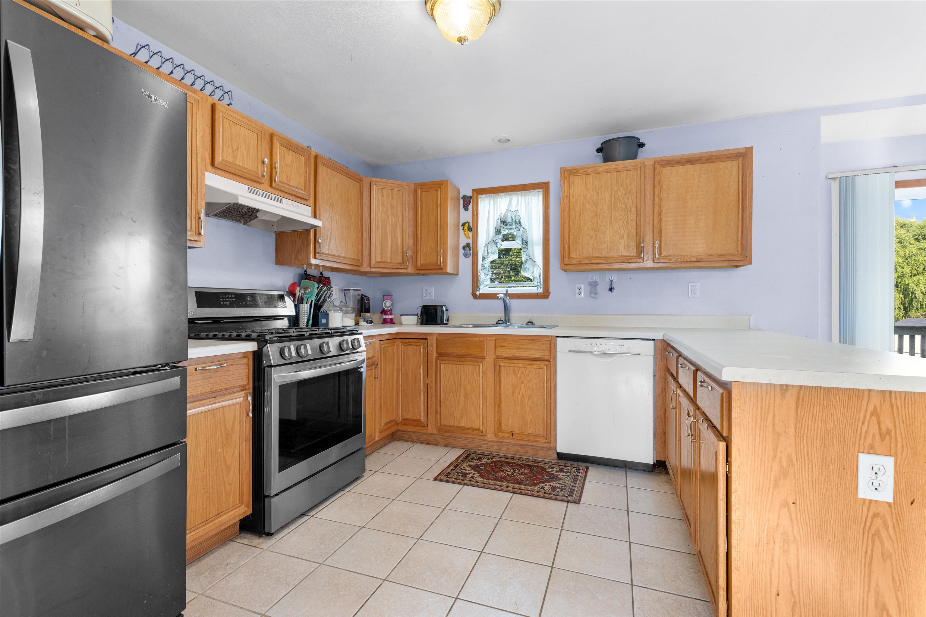1405 Sentry Drive Durand, IL 61024 - Photo 6 of 25 a kitchen with a stove a sink and a refrigerator