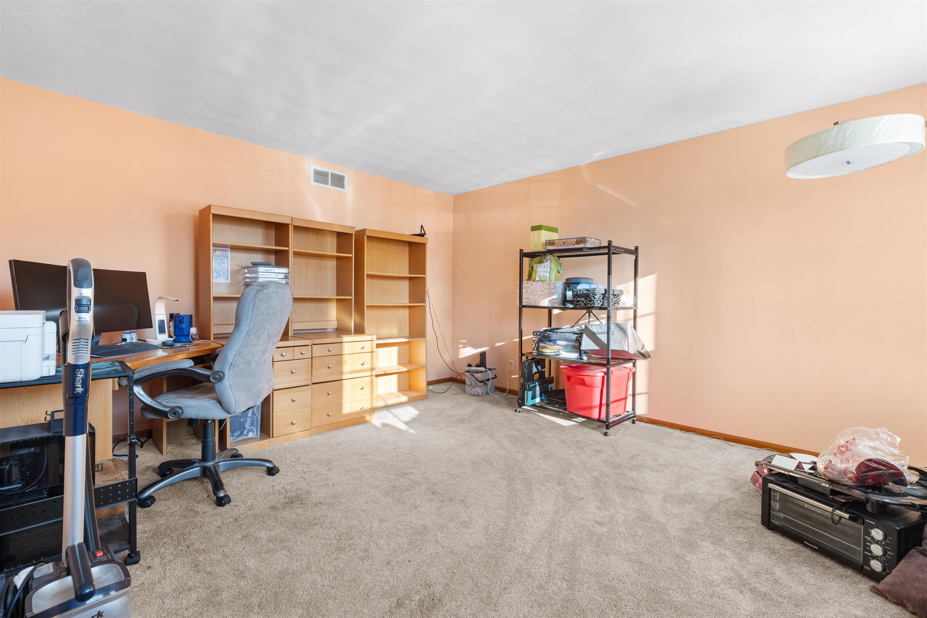 1405 Sentry Drive Durand, IL 61024 - Photo 8 of 25 a bedroom with furniture and a large window