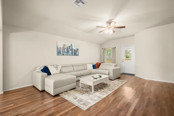a living room with furniture and a large window
