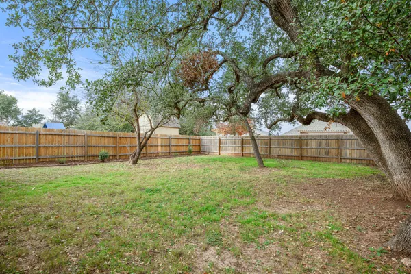 a bedroom with a bed and a mirror
