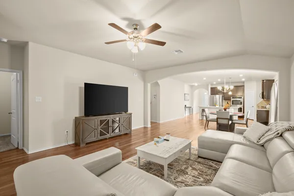 a living room with furniture and a flat screen tv