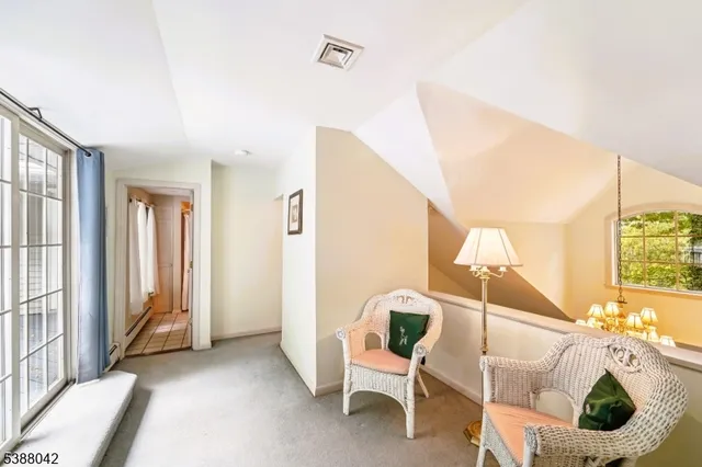 a view of a livingroom with furniture and windows