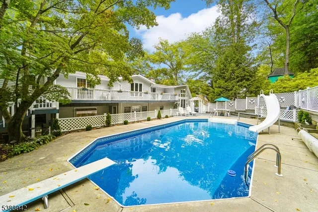 a view of a swimming pool with an outdoor seating