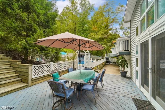 a view of outdoor sitting area with furniture and wooden deck