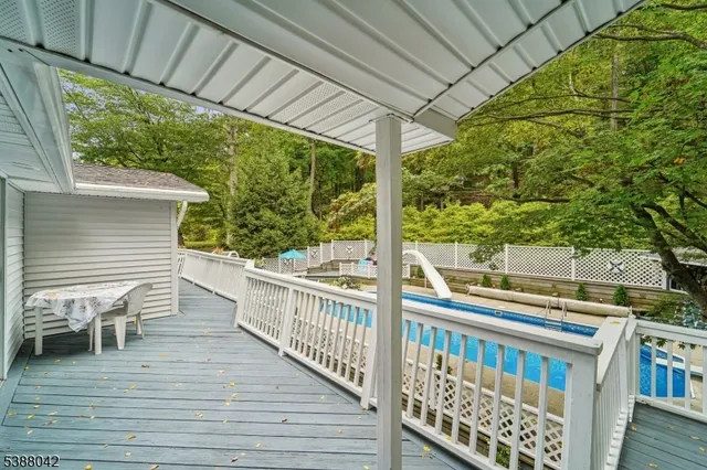 a view of a chairs and table in the balcony
