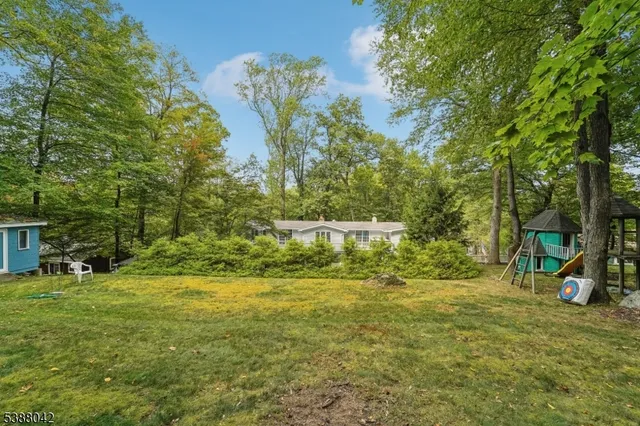 a view of outdoor space with deck and yard