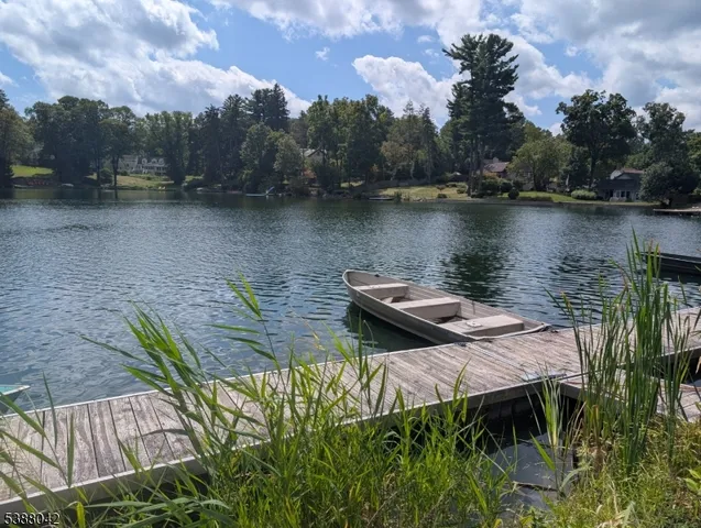 a view of a terrace with a table and chairs