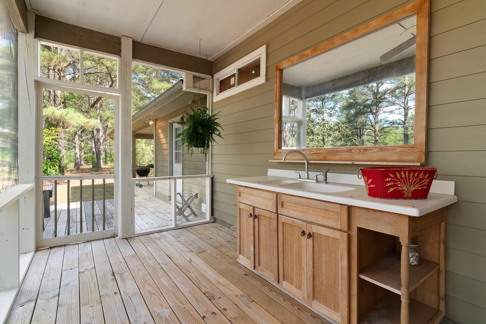 4353 Poverty Creek Road Crestview, FL 32539 - Photo 2 of 43 a bathroom with a sink and a large window