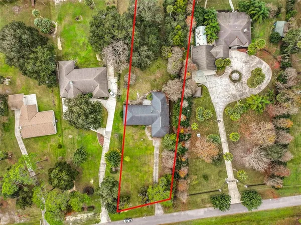 an aerial view of residential house with outdoor space