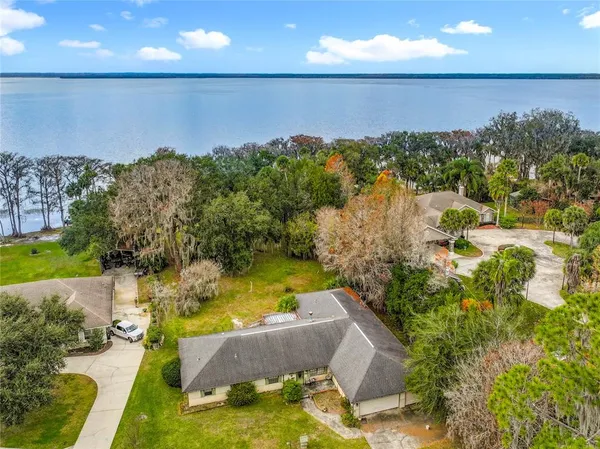a view of a swimming pool with a yard