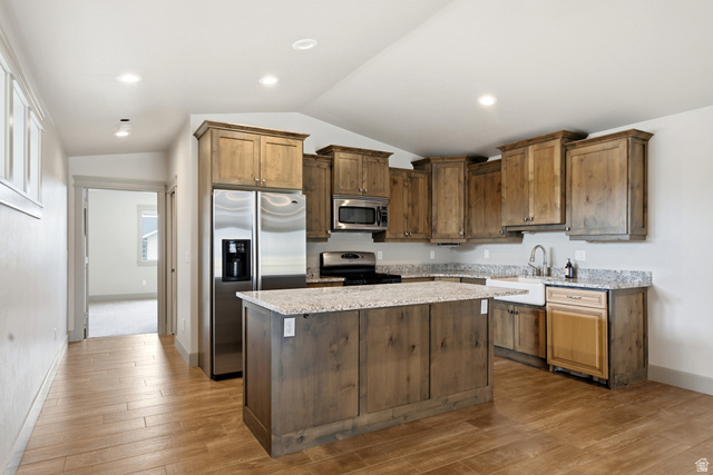 560 Aspen Road Francis, UT 84036 - Photo 38 of 59 Kitchen featuring wood-finish flooring, recessed lighting, wood cabinetry, stone countertops, and stainless steel appliances