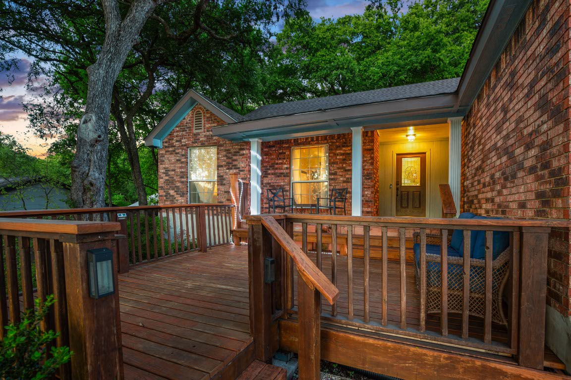 3015 Sunridge Drive Austin, TX 78741 - Photo 5 of 35 Deck at dusk featuring covered porch