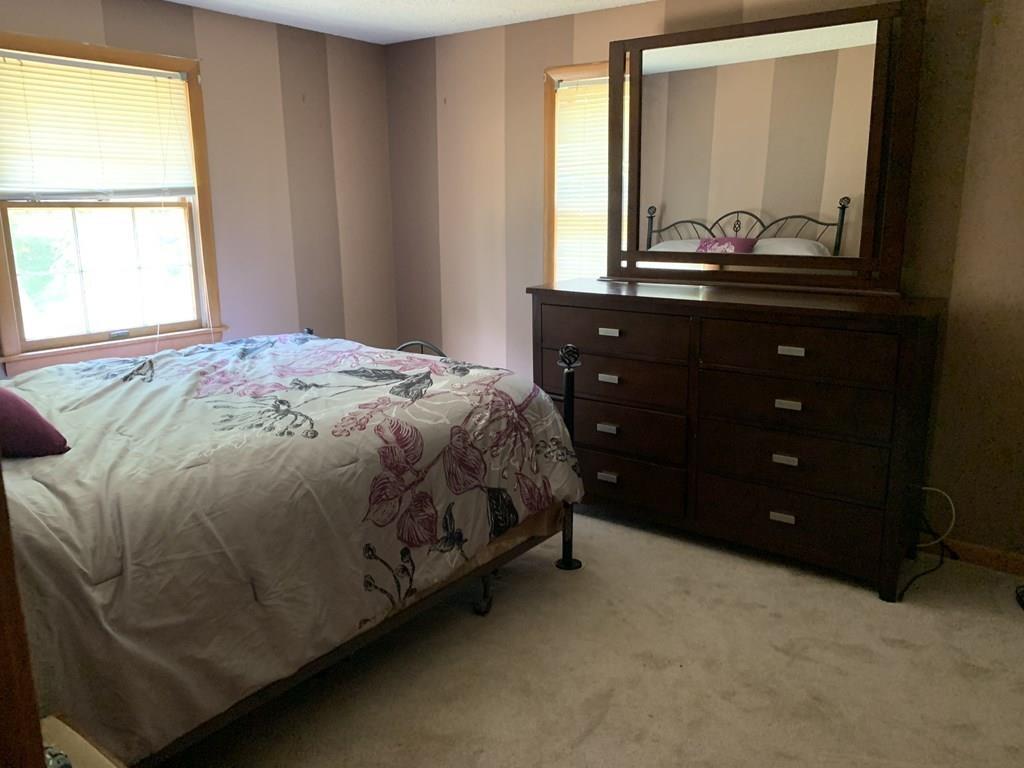 630 Wareham Street Middleboro, MA 02346 - Photo 5 of 10 a bedroom with a bed and a window