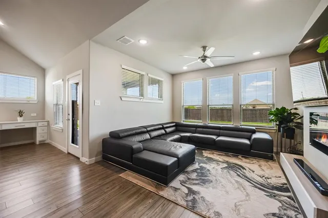 a living room with furniture and a large window