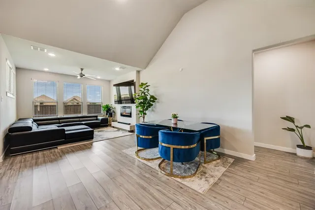 a room with wooden floor and furniture