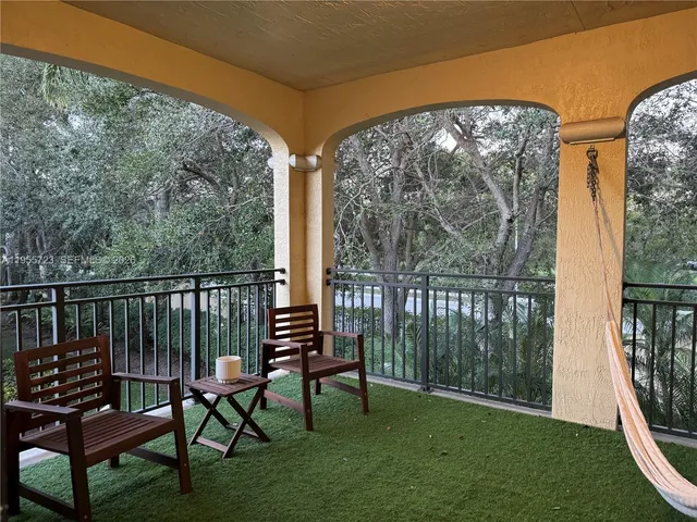 a view of a two chairs in the patio