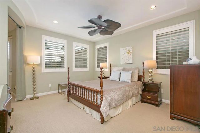 a bed room with a bed and a chandelier