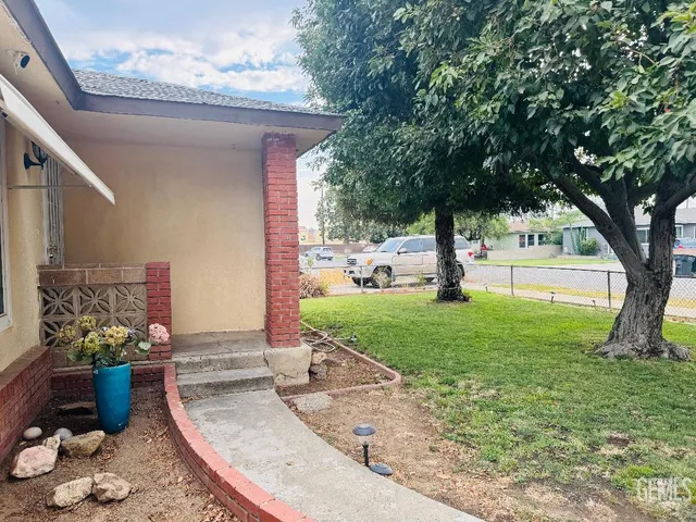 a view of a porch with furniture and a fire pit