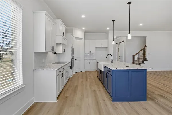 a large kitchen with stainless steel appliances kitchen island a large island in the center
