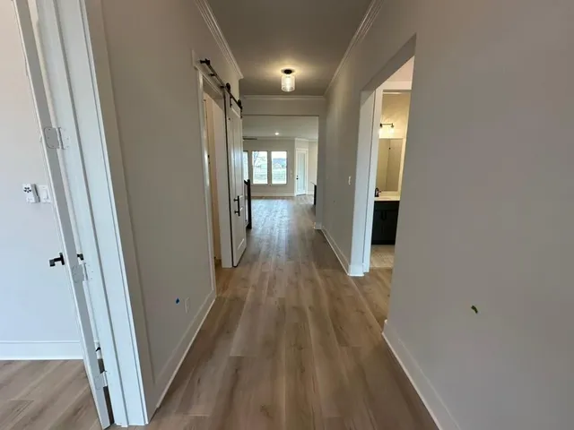 a view of gallery with wooden floor