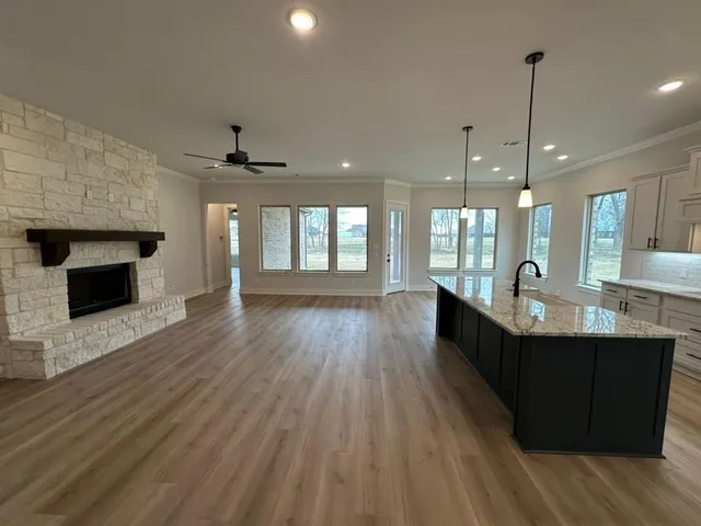 a view of a room with wooden floor and staircase